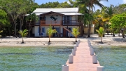 0.95 acres of Pristine Beachfront and Home